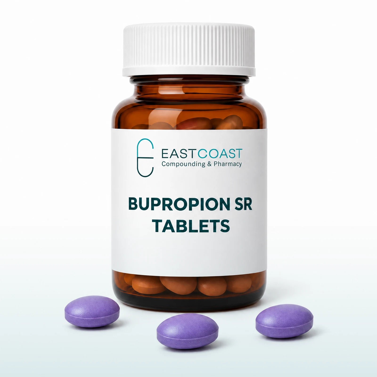 Bupropion SR tablets in an amber pharmacy vial with East Coast Compounding & Pharmacy label, purple tablets beside it (illustrative image)