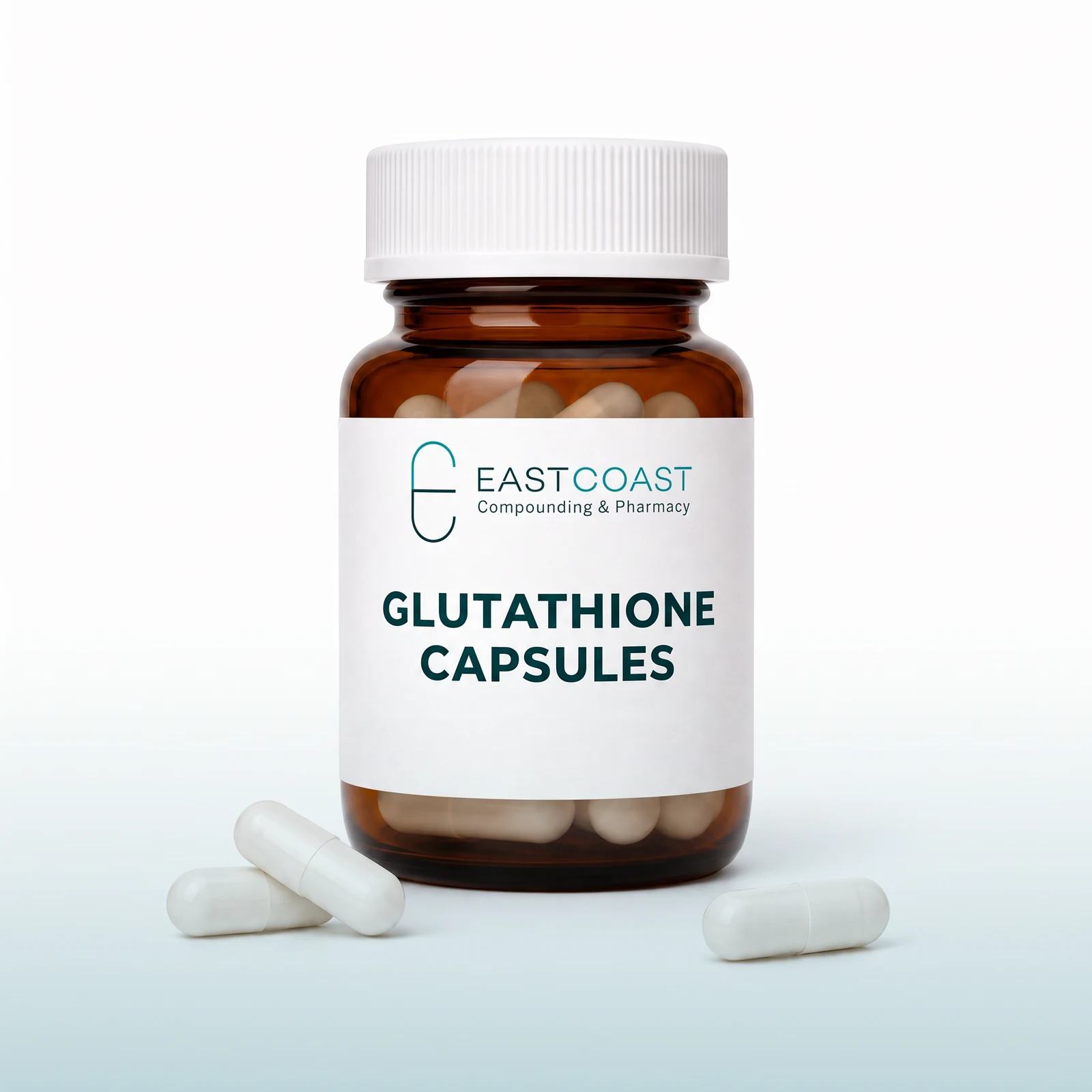 Glutathione capsules in an amber pharmacy vial with East Coast Compounding & Pharmacy label, white capsules beside it (illustrative image)