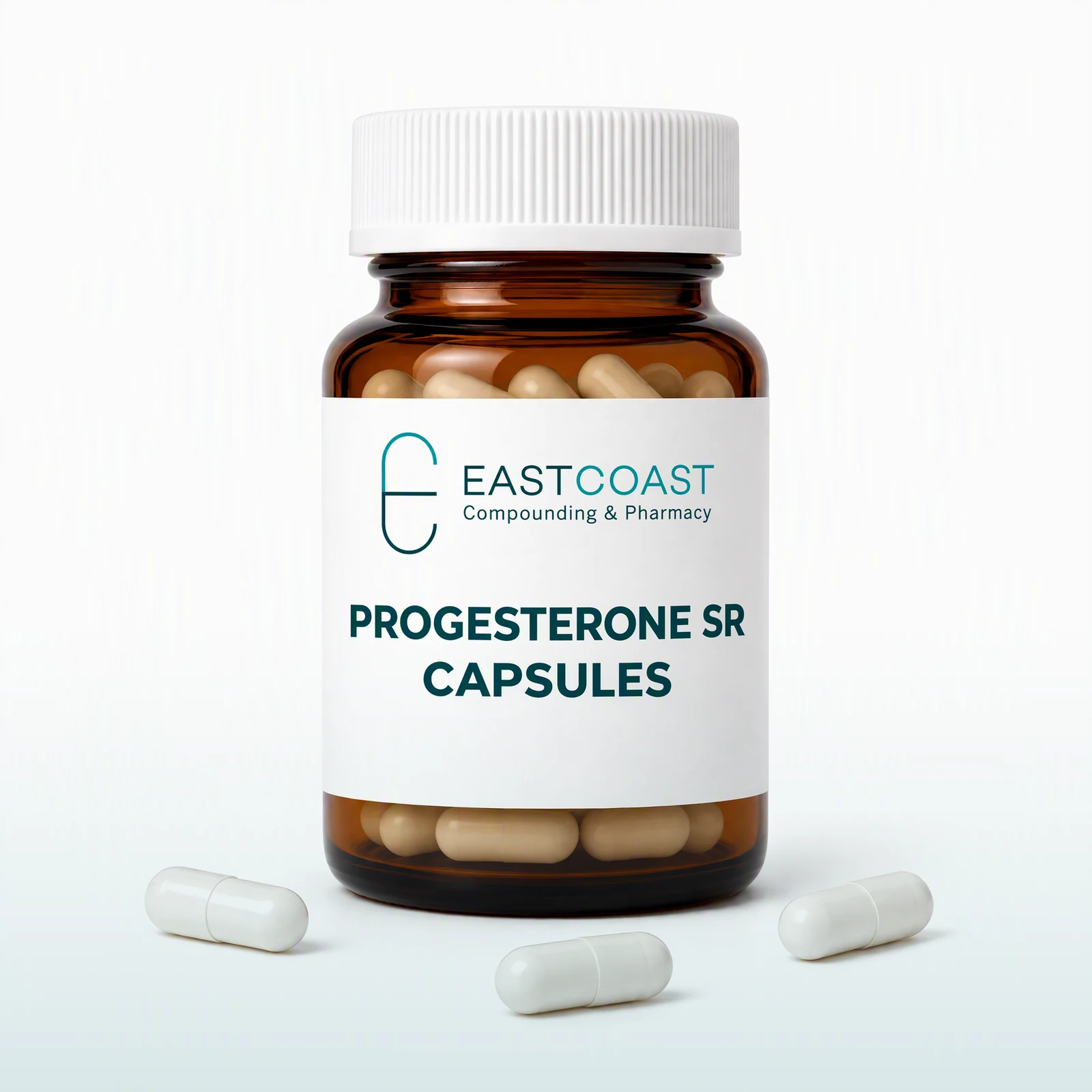 Progesterone SR capsules in an amber pharmacy vial with East Coast Compounding & Pharmacy label (illustrative image)